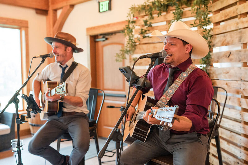 musicians playing guitar in the barn at barnwood events in madison, winconsin.