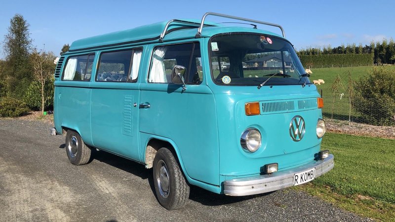 Right hand side and front on view of Rhonda, teal retro kombi van from NZ Kombi Hire