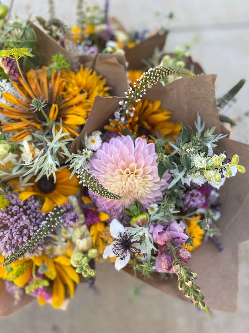 bouquets wrapped in brown paper for flower CSA