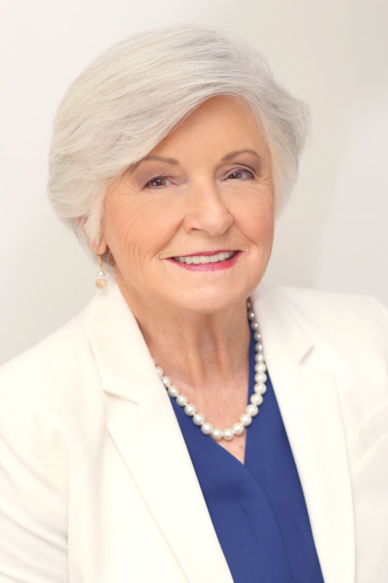 Female business mentor Frances Avrett wearing a white blazer smiling at the camera.