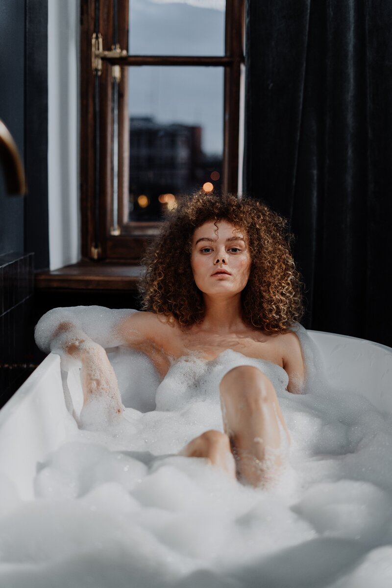 topless-woman-in-bathtub-with-water-4155481