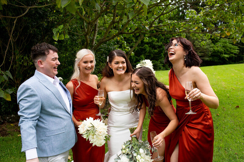 Bridesmaids and Bride laughing together and having a good time