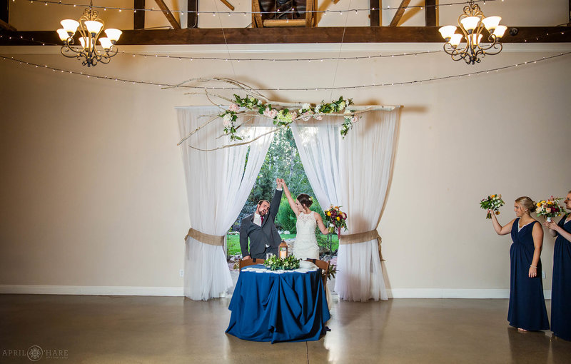 Bride and groom at their sweetheart table at Church Ranch Event Center