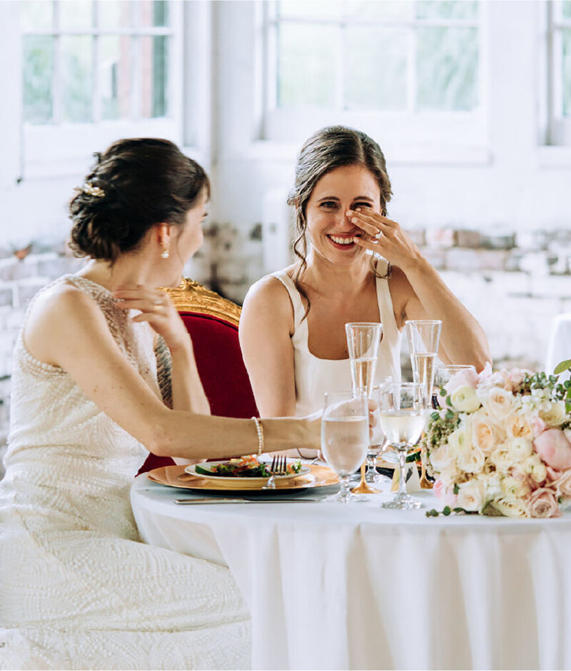 bride crying happy tears at table