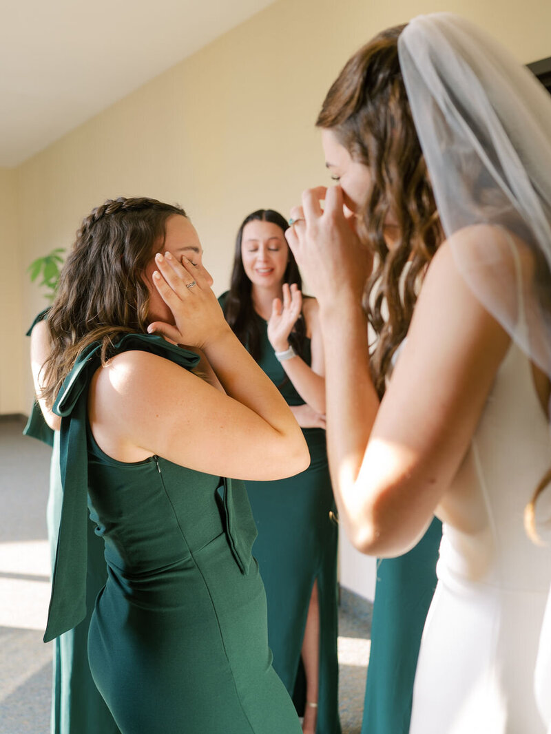 Bride and bridesmaids cry during first look