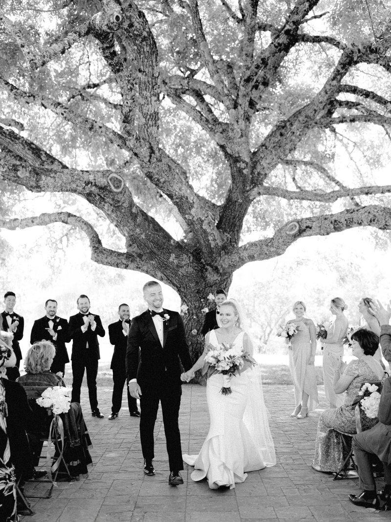 couple walking down the aisle at triple s ranch