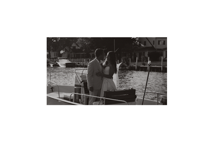 bride and groom popping champagne