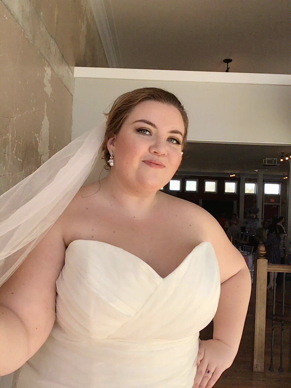 Bride playing with veil for a GIF