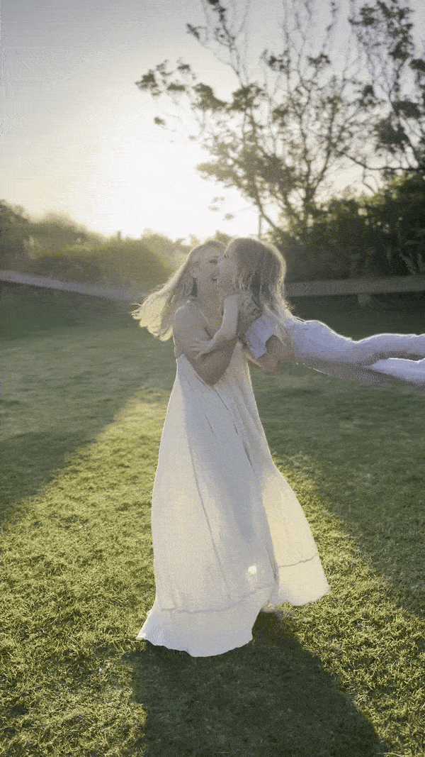 aimee kelly spinning her daughter around during a family photoshoot in new plymouth