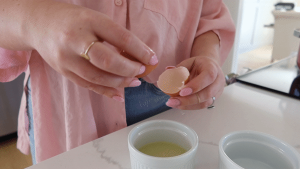 GIF of Mollie Mason separating an egg above a small dish