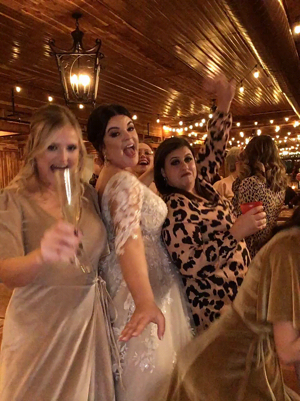 Bridesmaids and Bride shimming in photo booth GIF