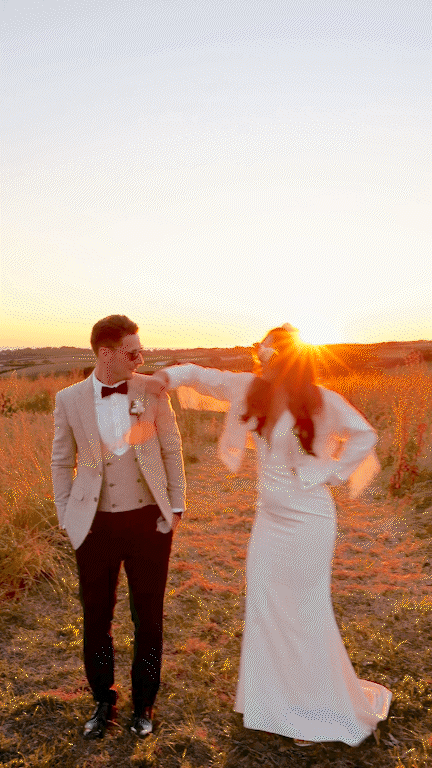 cool looking bride and groom at sunset