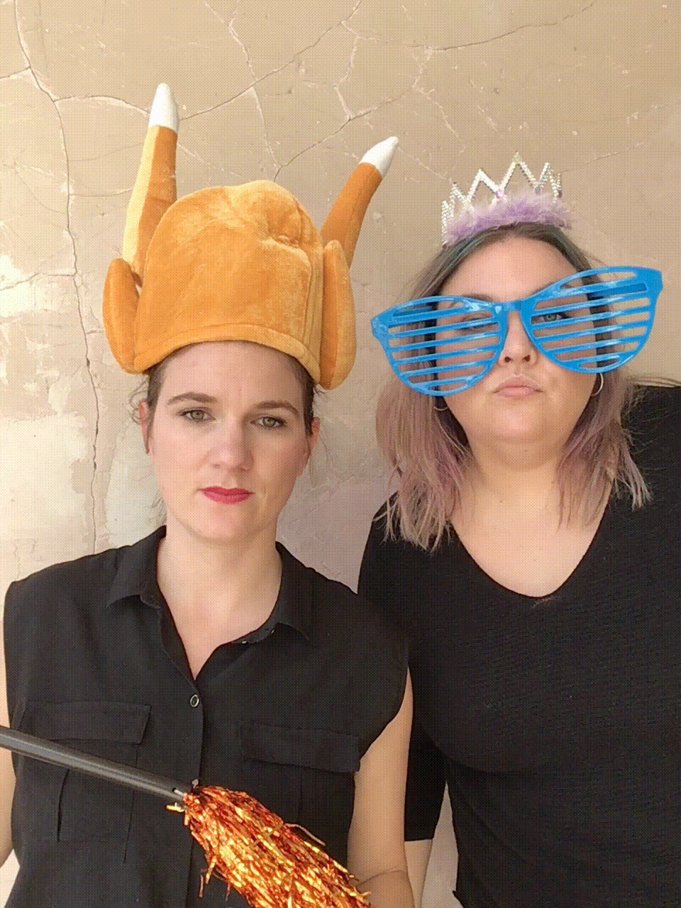 Ladies in photo booth wearing turkey hate and princess crown