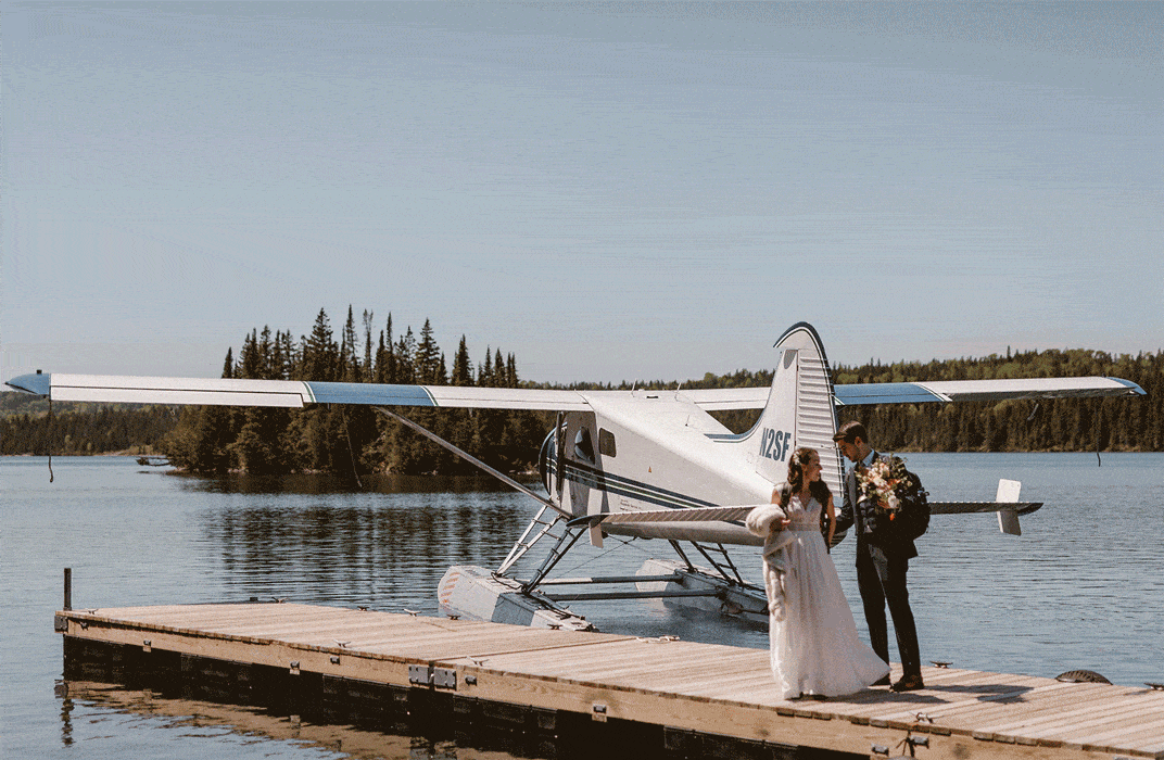 Isle Royale elopement photography with bride and groom in front of a float plane