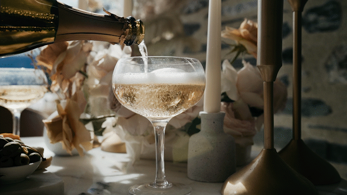 The Lovers Elopement Co - champagne pour at elopement wedding in Queenstown