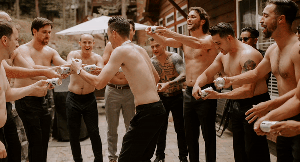 gif of groom and groomsmen shotgunning a beer