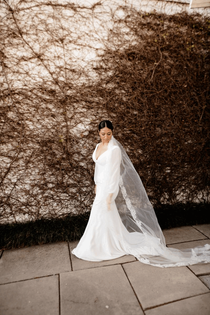 A moving GIF of a bride at Ravensthorpe walking and moving her veil.