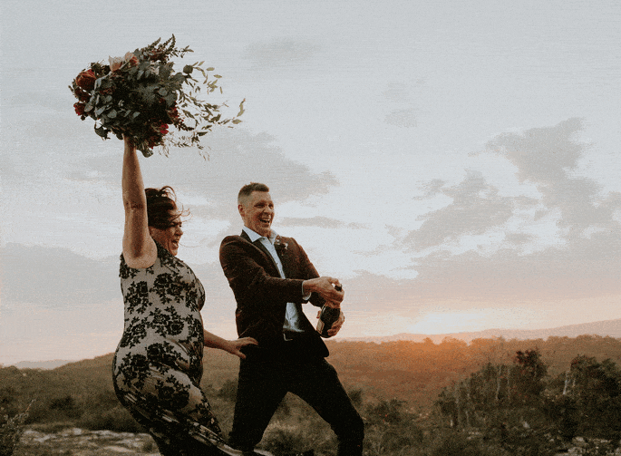 Fun video gif of spraying champagne at sunset on a wedding day