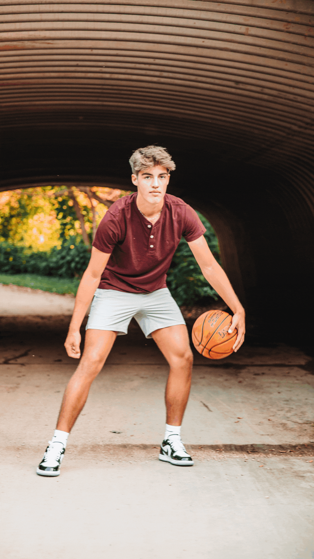 Senior playing basketball during their senior photography experience