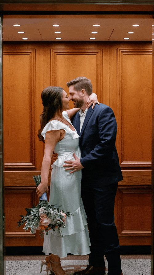Professional photo of elevator closing on couple getting married in DFW wedding