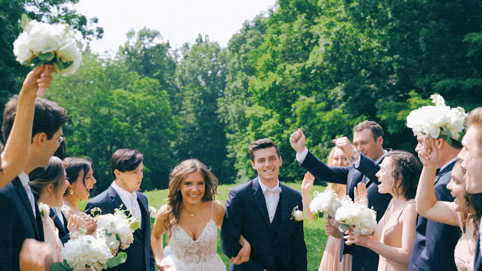 Bridal Party cheering for Bride and Groom as they run at Prickel Barn in Kentucky