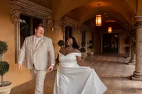 Bride and groom dancing together at their elegant indoor wedding venue