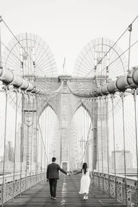 A timeless black and white portrait of a couple by the East River, capturing a genuine connection during their multi-day wedding celebration.