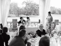 A candid black and white capture of a bride being moved by a toast at Cairnwood Estate, highlighting genuine connection.