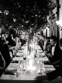 A refined composition of a long candlelit reception table at Wythe Hotel, preserving the atmosphere and emotion of an intimate dinner.