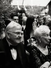 A black and white view of a wedding ceremony at Wythe Hotel of guests, preserving the atmosphere and emotion of an intentional Brooklyn celebration.