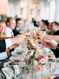 A candid capture of guests toasting at Cairnwood Estate, highlighting genuine connection.