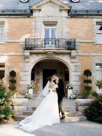 A refined composition of a bride and groom in front Cairnwood Estate, capturing an intentional presence for a documentary style gallery.