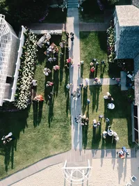 Aerial photography of a luxury outdoor cocktail hour on the lawn at Chatham Bars Inn in Cape Cod.