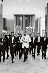 Groom and groomsmen at The Thompson Hotel Dallas — black tie wedding