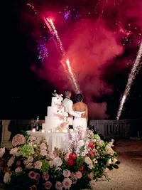 Wedding toasts with fireworks at Villa Lario Resort Mandello Lake Como Italy destination wedding