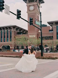 Bride and groom kiss in the street at Hotel Vin Grapevine Texas wedding — Stephanie Michelle Photography