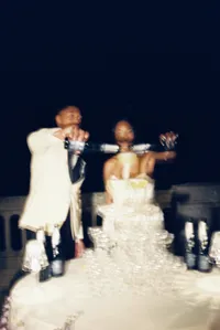 Couple pouring champagne at their wedding at Villa Lario Resort Mandello Lake Como Italy