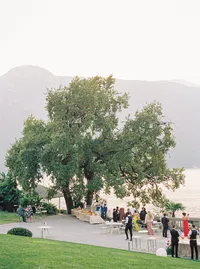 Wedding guests at aperitivo hour Villa Lario Resort Mandello Lake Como Italy