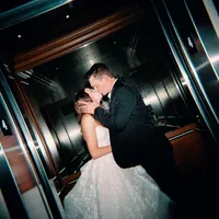 Bride and groom in elevator kissing at Hotel Vin Grapevine Texas wedding — Stephanie Michelle Photography