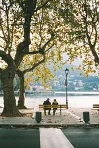 Cute couple on park bench in Lecco Italy