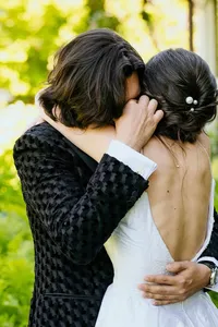 Groom cries as he hugs his new bride