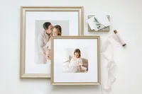 Two silver framed portraits styled with silk ribbon and keepsake stationery