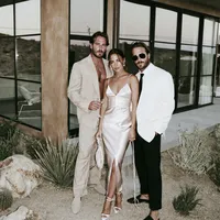 superherodesignco_34572_Bride_and_groom_standing_outside_a_mi_e1ce05ad-0bd0-4517-8aa6-36248dd2360f_2