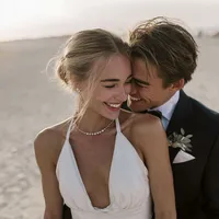 superherodesignco_34572_bride_and_groom_embracing_at_golden_h_749ab9e8-ed5f-4a88-b069-af56be7a418f_0