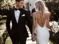 superherodesignco_34572_bride_and_groom_walking_hand_in_hand__6f4bf8b6-69b0-4cec-950d-9bf946a08b2b_2