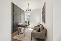 Office with Urbane Bronze accent wall with wood trim squares on wall