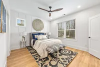 primary bedroom with accent wall