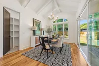 vaulted ceiling dining room walkin pantry and sliding door to outside