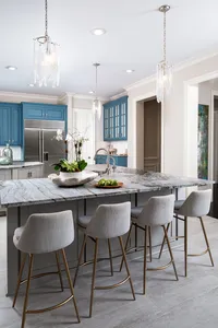 kitchen remodel design in Waxhaw. Gracious Home Interiors residential interior design services. Custom kitchen with bright blue cabinetry. Kitchen with colorful cabinets.
