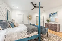 painted four post bed in master bedroom